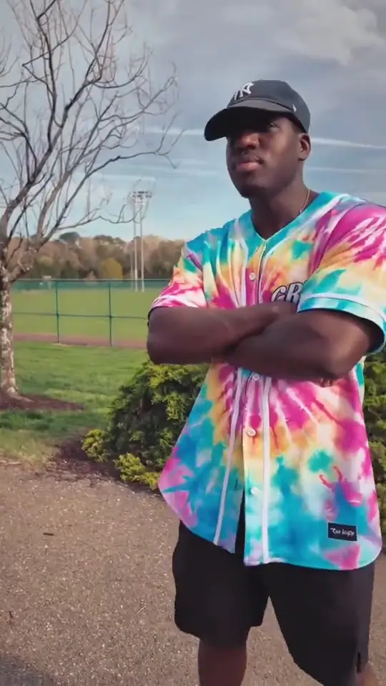 Raver in a tie-dye reversible baseball jersey